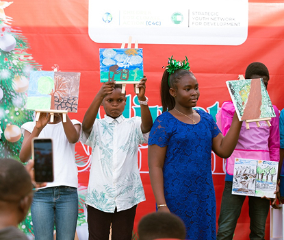 Children presenting climate drawings