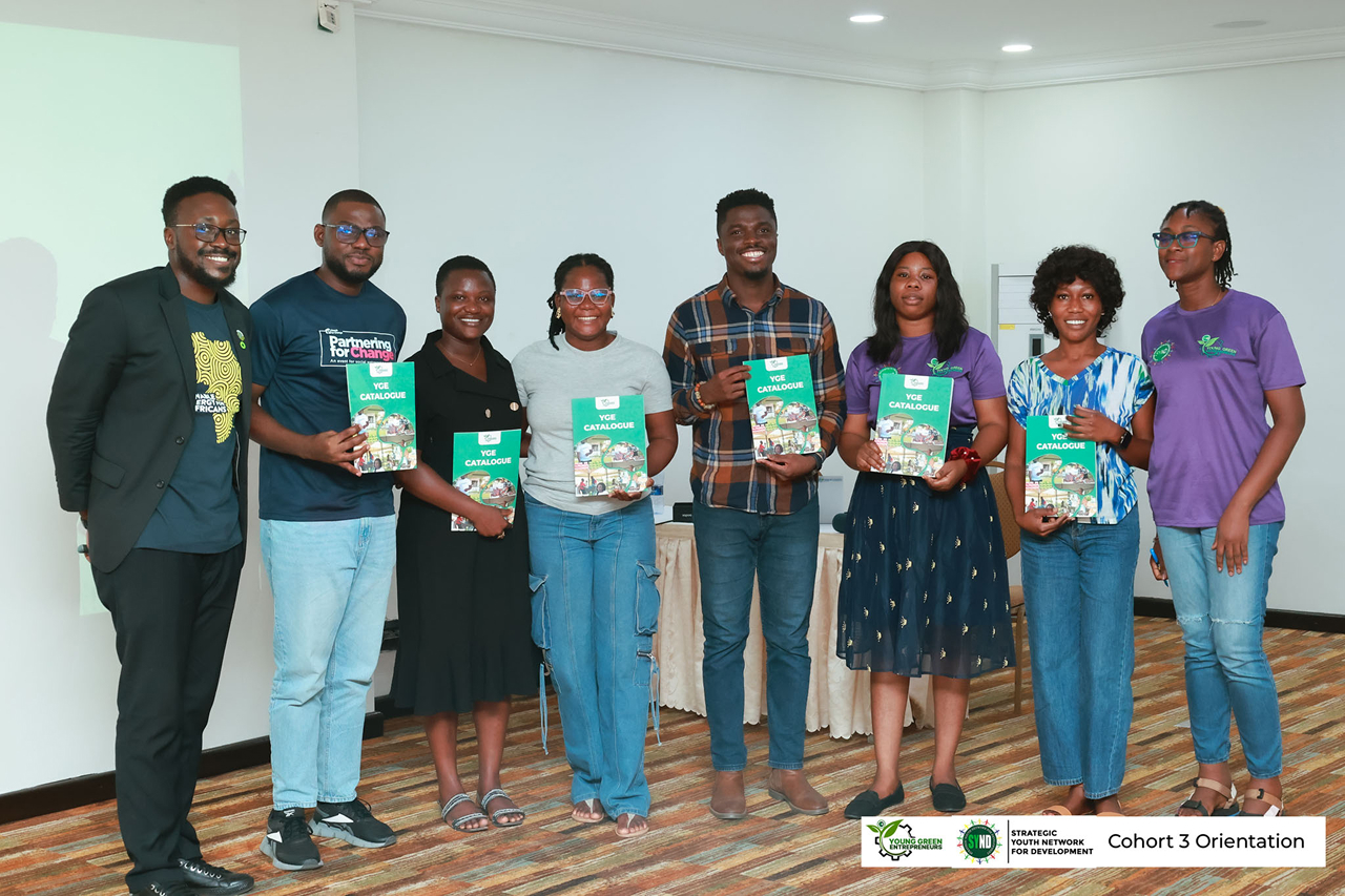 Young Green Entrepreneurs holding YGE catalogues